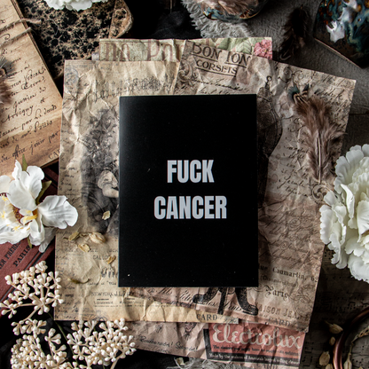 Card with 'FUCK CANCER' text in a decorative frame surrounded by flowers and textures
