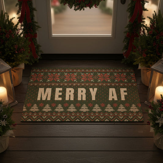 Decorative doormat with 'MERRY AF' text on a wooden porch with Christmas decorations.