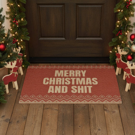 Doormat with 'Merry Christmas and Shit' text in front of a decorated Christmas door.