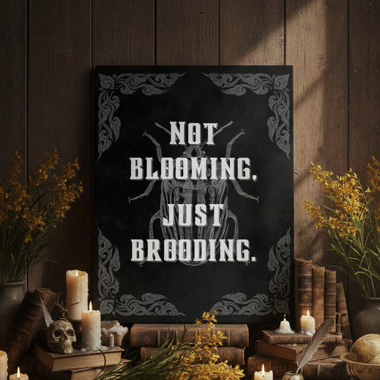 Decorative setup with a sign reading 'Not Blooming, Just Brooding' on a wooden wall.